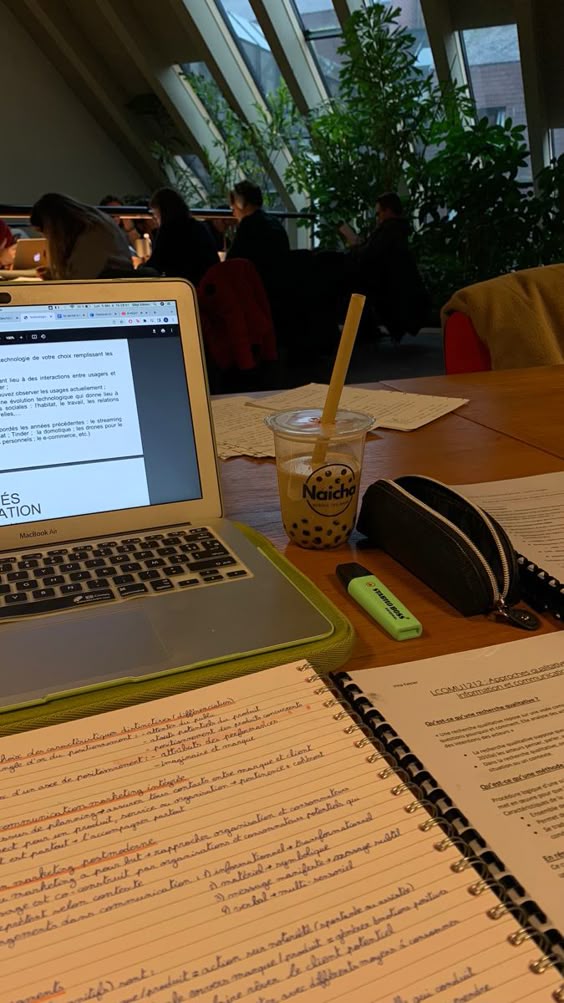 Studying in a library with plants