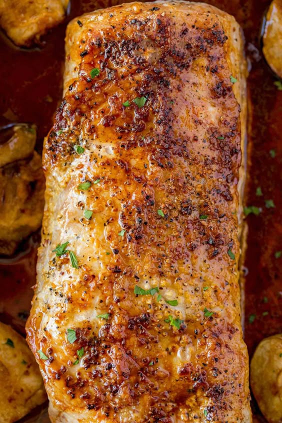 Ultimate Garlic Pork Loin Roast made with just five ingredients, it is easy enough for a weeknight meal and fancy enough for your holiday dinner parties!