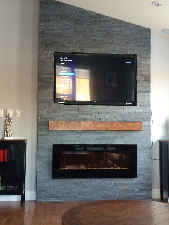 Grey stone fireplace with floating mantle electric fireplace