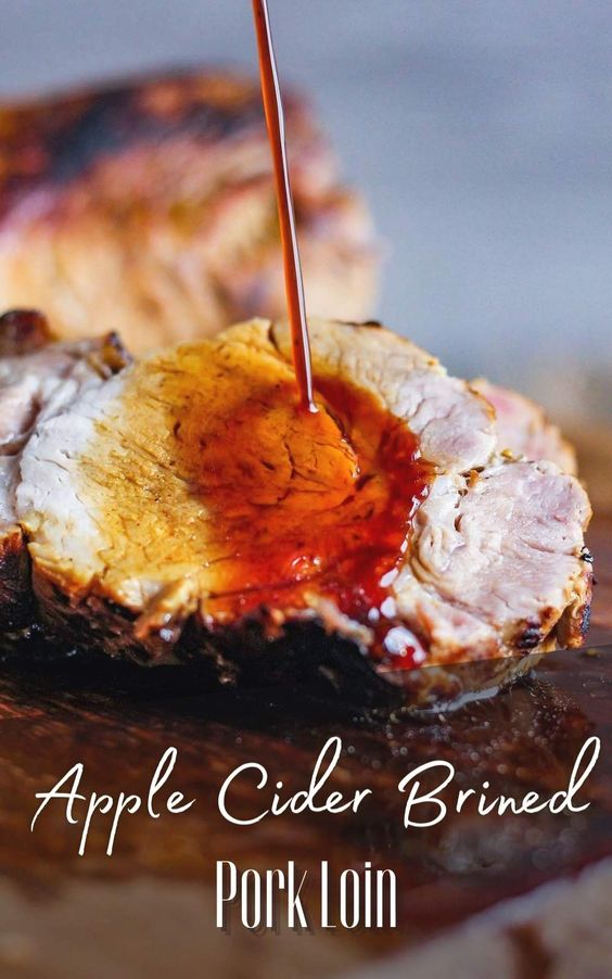 Served with roasted vegetables, this simple showstopping apple cider brined pork loin is perfect for a crowd. Naturally gluten-free, it is extremely tender and juicy and infused with the most magnificent flavor. #appleciderporkloin #appleciderpork #porkloinrecipes #brinedpork #porkloinoven
