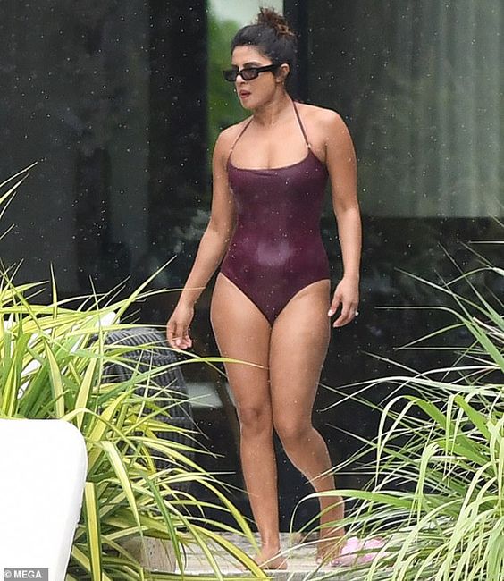 Priyanka Chopra is a soaking wet bombshell in a clinging one-piece as she frolics in the pool | Daily Mail Online