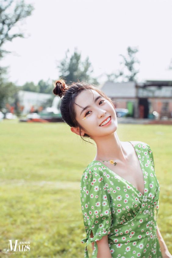 Xing Fei poses for photo shoot