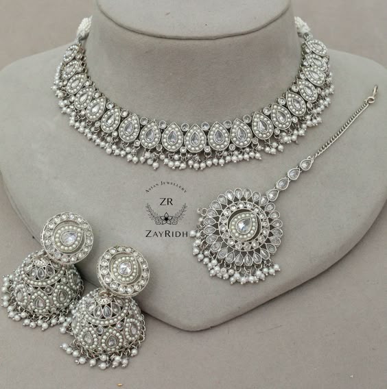 Do you love to make yourself different in any wedding event with respect to jewellery sense? This gorgeous choker set is all set to give you your desired look and style. About Anjali Necklace Set - Any formal dress will be enhanced by this amazing necklace choker set - The gorgeous colour variety of Indian choker sets is available for you - Any event i.e. Mehandi, nikkah, Haldi, or any dress including saree, lehenga this Asian choker set creates your look different Dimensions are as follows: The