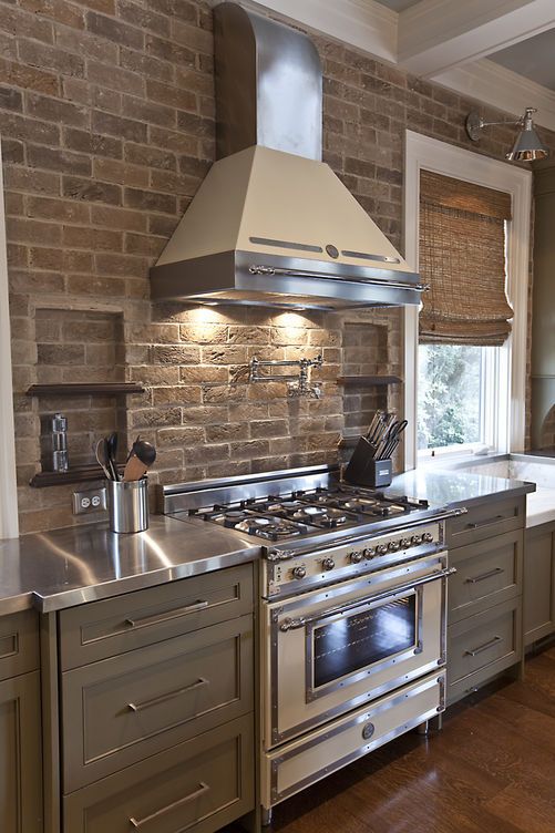 Brick splash and the niches are a wonderful idea! Cabinet color and stainless tops are great too!>>>Gosh, I love this cooking space!