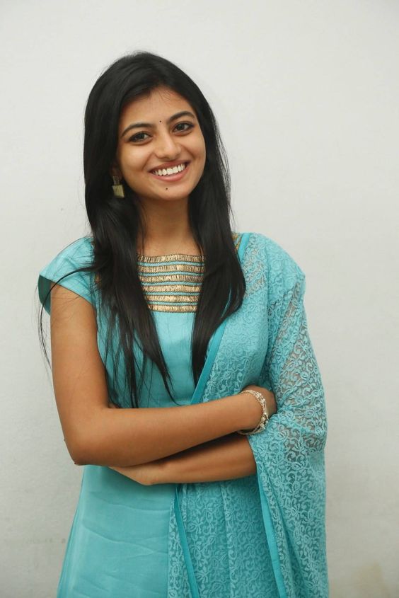 South Indian Model Anandhi Smiling Stills In Green Dress