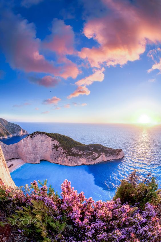 Navagio beach with shipwreck against sunset on Zakynthos island in Greece - Navagio beach with shipwreck against sunset on Zakynthos island in Greece