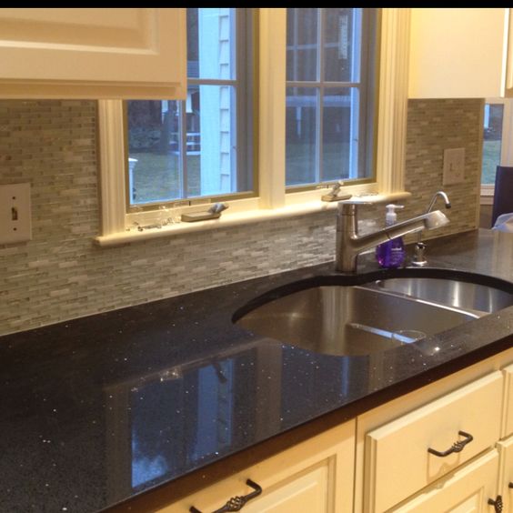 Sparkling black quartz counter with glass backsplash. So inlove with this counter!!!