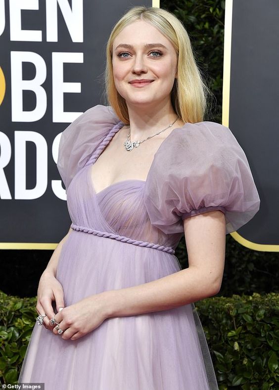 Dakota Fanning exudes fairy tale princess vibes in a mauve gown