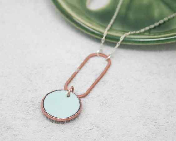 Necklace with enameled penny suspended on copper oval on the chain. The chain length is adjustable from 16 to 18"Pendant measures 2"Penny jewelry is a great copper anniversary gift.Many buy my enamel penny jewelry as a "pennies from heaven" gift, to remember a loved one.You can order these with a custom date (between 1940 and 1982) buy adding this custom date upgrade here