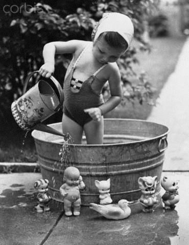 Tub filled with water from the hose early in the morning, heated by the sun, fun playtime in the afternoon!