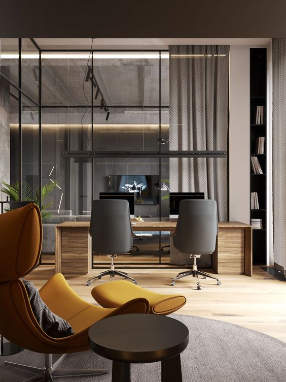 A Glass Wall Separates The Living Room From The Home Office In This Modern Loft Apartment