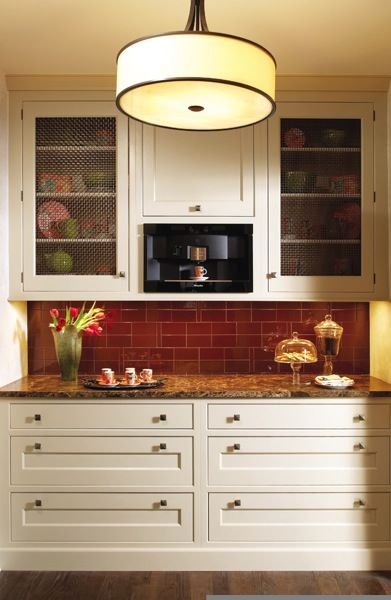 modern take on a butler's pantry - love the red tile and drum shade!