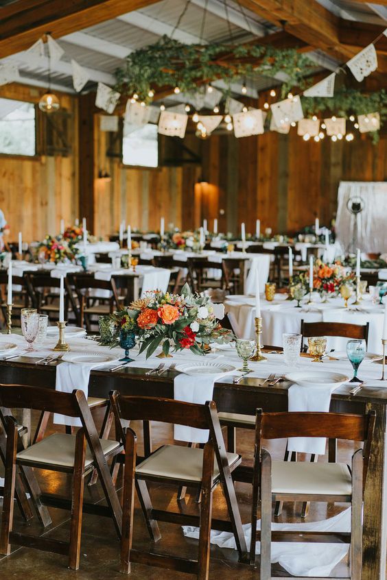 Searching for summer wedding inspiration? We’ve got you covered! Bright hues, colorful florals, and a dreamy outdoor venue — this ceremony and reception has all the perfect elements for a warm weather wedding. See more inspiration for your wedding at rusticweddingchic.com | Photo: @michelleelysephoto