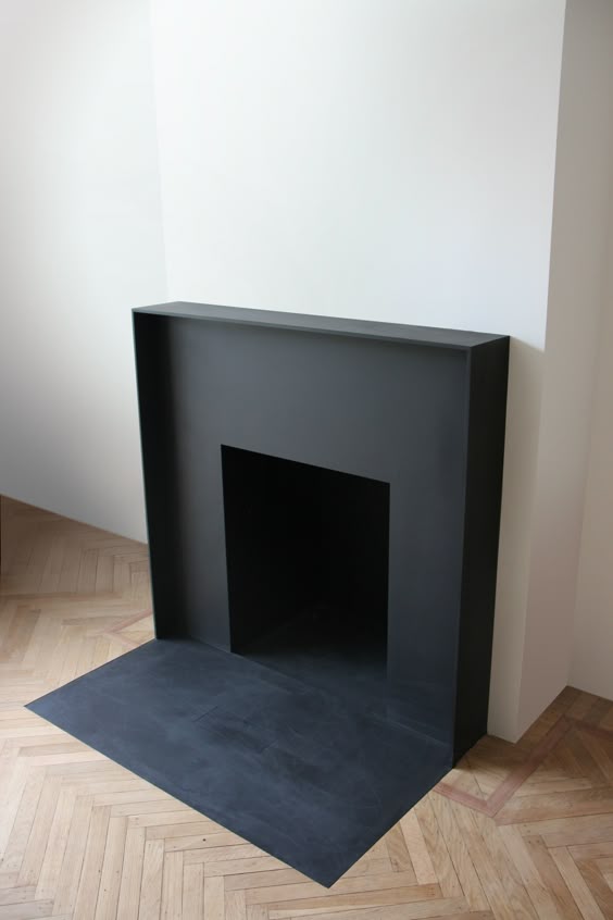 Fireplace love. Black fireplace surround and hearth.