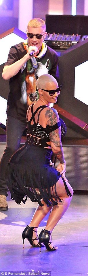 True to form, the 32-year-old video vixen made sure no one could miss her bombshell curves as she hopped on stage with rapper Macklemore for a wild twerk session.