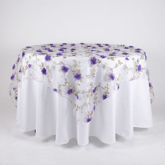 Size: Approx. 72 inch x 72 inchStyle: OrganzaMaterial: PolyesterEdges: SergedCount: 1 PieceCare: Dry clean, Hang dry onlyChange it up with our organza with roses overlay that has exquisite 3D-like roses that is beautiful and unique for any occasion in mind. This overlay is perfectly classy for any center piece to wow your guests and adds an extra elegance. Color: Purple Size: 72 Inch x 72 Inch Material: Organza Shape: Square Product Grade: Basic