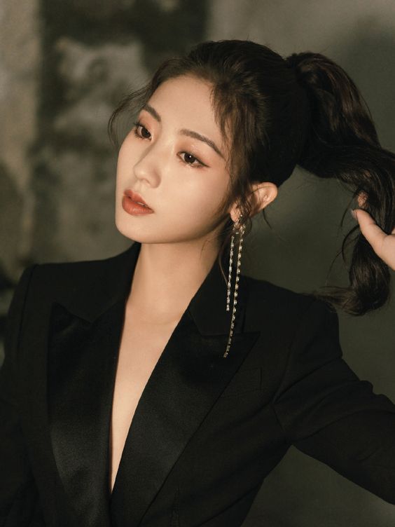 Xing Fei poses for photo shoot
