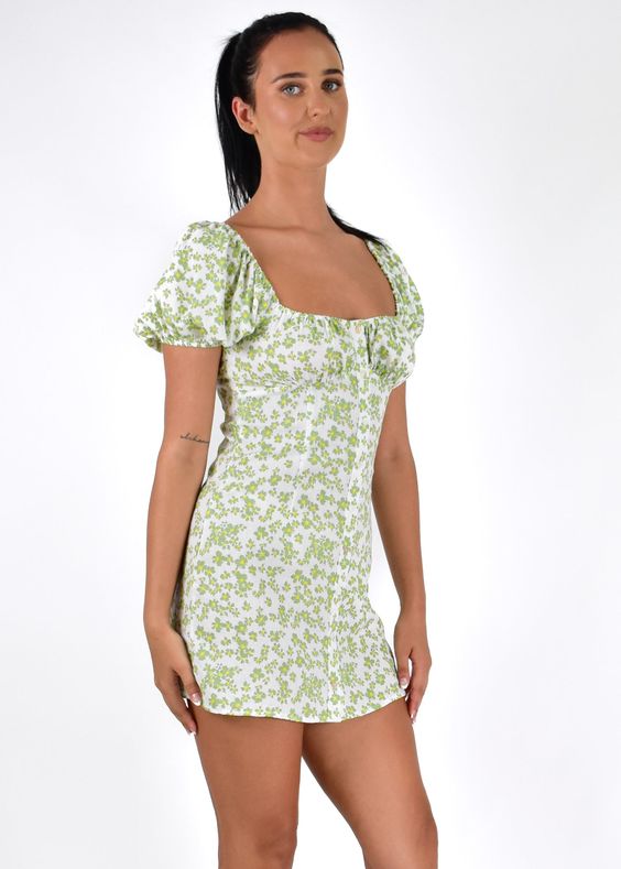 Butter wouldn\'t melt with our sweet Randi Mini Dress! featuring subtle puff sleeves and a button down front, pair her with our Slidin by Therapy to add a layer of edge! Floral mini dress Puff sleeves Self tie back Back zip Button down front Material: Cotton Model wears size 8