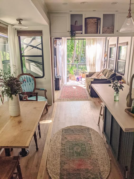 This Toy Hauler renovation from @switlife.mnc is filled with thrifted finds and budget-friendly DIY projects. Come see how a family of 5 lives in this cozy home on the road. #rvrenovation #toyhauler #rvingwithkids #rvremodel #rvreno #campermakeover #rvlife #rvinspiration