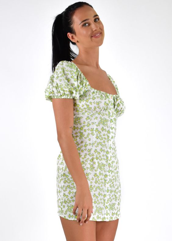 Butter wouldn\'t melt with our sweet Randi Mini Dress! featuring subtle puff sleeves and a button down front, pair her with our Slidin by Therapy to add a layer of edge! Floral mini dress Puff sleeves Self tie back Back zip Button down front Material: Cotton Model wears size 8