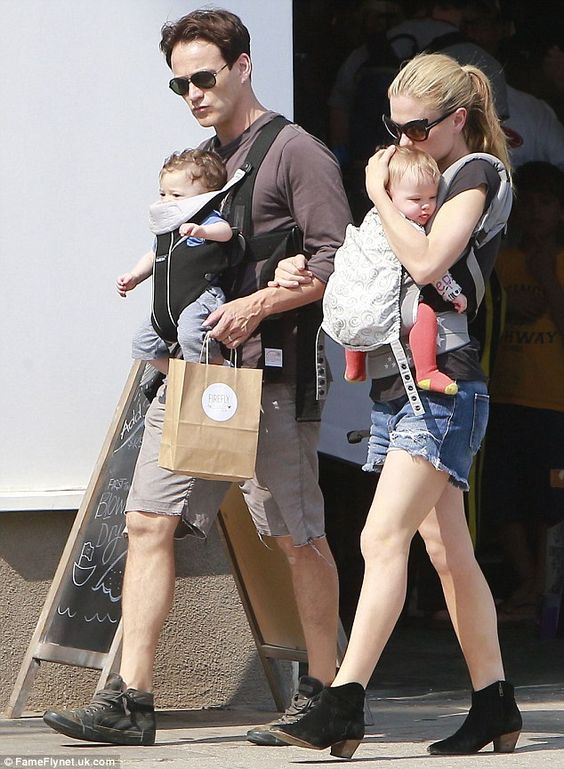 True grit! Anna Paquin shows off toned body as she does heavy lifting on a family day out with husband Stephen Moyer