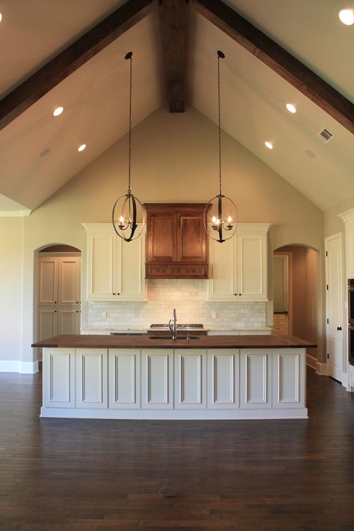 Vaulted Ceiling Wood Counter Top Island In Kitchen Parade Of Homes 2018 Lighting Home Remodeling New - How To Install A Pendant Light On Sloped Ceiling