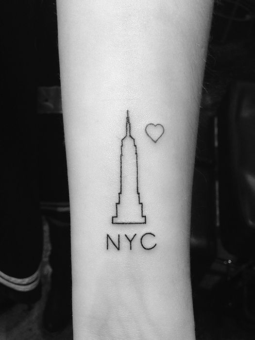 Single needle NY Skyline tattoo on the inner forearm.