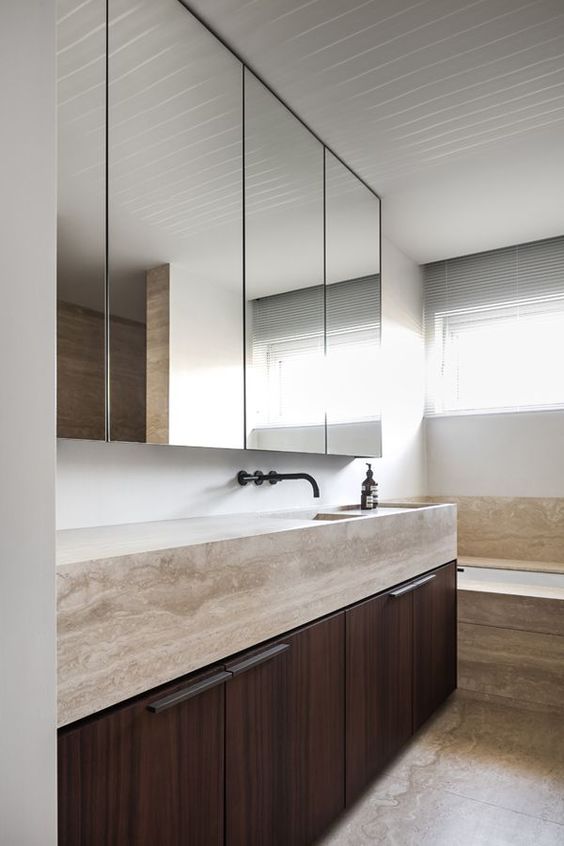 Love the minimalist lines of this wall hung stone bathroom sink vanity