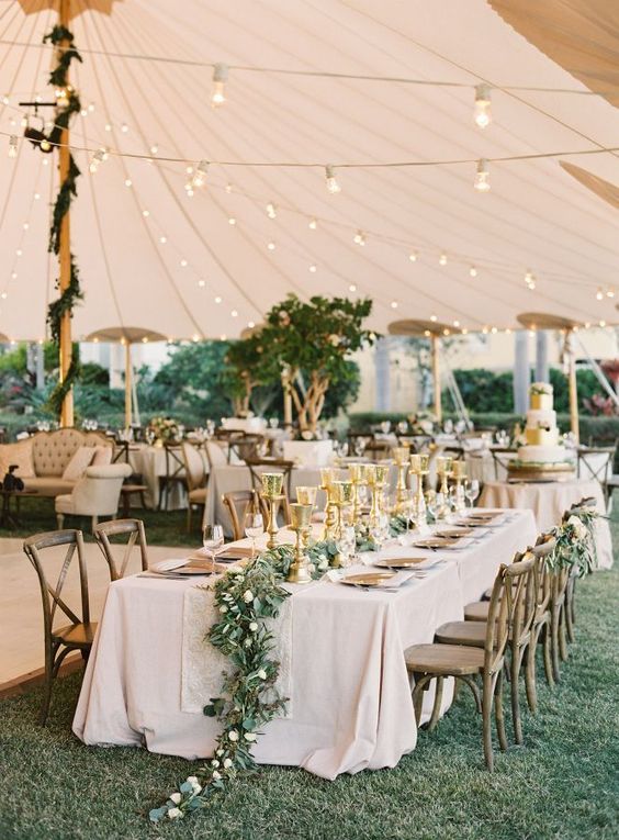 This wedding is a day of three parts. Part one, a beautiful ceremony in front of the bride\'s family home. Part two, champagne at sunset. And part three, a tented reception that\'s straight from our dreams. Kuddos to Tracie Domino Events, A&P Designs, Sperry