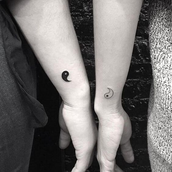 You can get this tattoo with someone important in your life, the yin and yang symbols can really cement your relationship. These small inking are on the side of the hand but would look great on other areas of the body too. #tattoofriday #tattoos #tattooart #tattoodesign #tattooidea