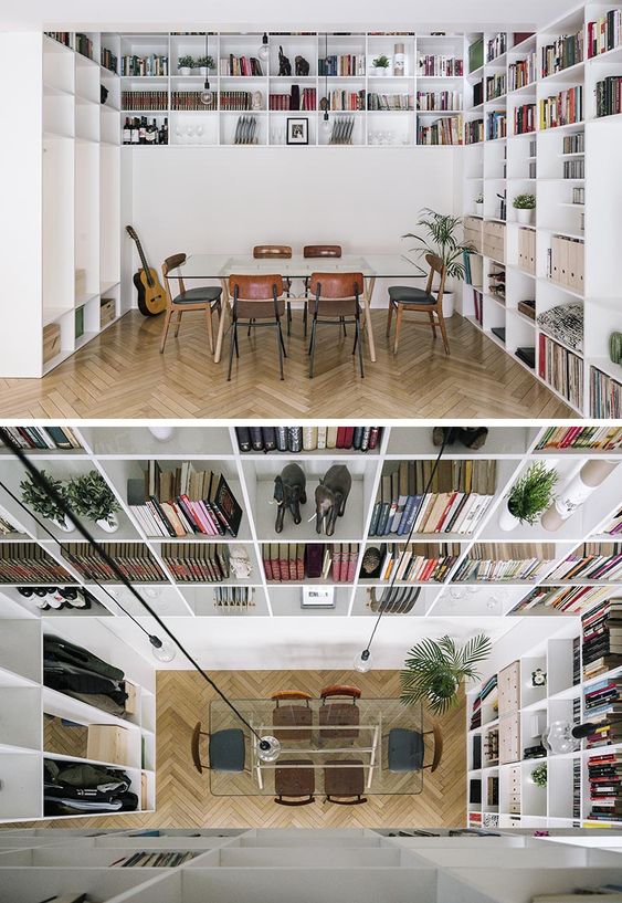 A Double-Height Bookshelf Travels Over Two Floors Of This House