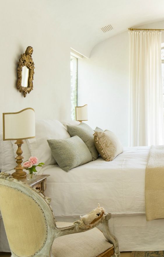 MODERN FARMHOUSE BEDROOM with French Country interior design inspiration from truly a house beautiful. A neutral French Country bedroom with aqua accents at Patina Farm, a serene modern farmhouse by Giannetti Home. The romantic decor, antiques, and bespoke furniture combine for a sophisticated, timeless, and tranquil result. #modernfarmhouse #frenchcountry #interiordesignideas #serene #patinafarm #farmhousestyle #eurpeancountry #antiques #interiordecorating #bedroomdecor