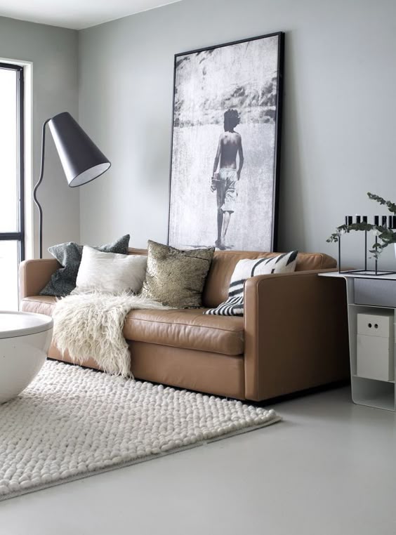 Sofa da tphcm với cách trang trí sofa cùng gối và bàn cafe