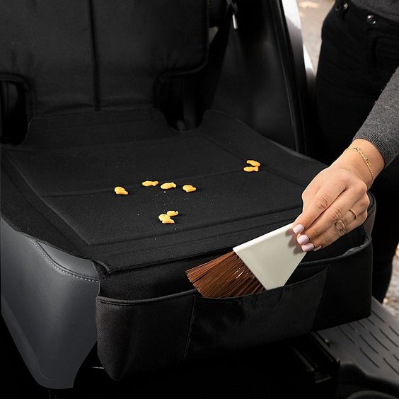 Skip*hop Style Driven Clean Sweep Car Seat Protector In Black - The SKIP*HOP Style Driven Car Seat Protector catches dirt, crumbs, and spills that occur during everyday traveling. This sturdy protector fits under most car seats to keep upholstery looking great. Use the included brush to sweep away messes.