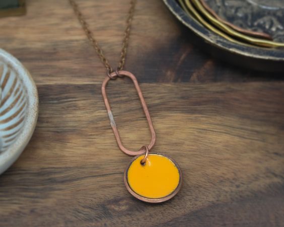 Necklace with enameled penny suspended on copper oval on the chain. The chain length is adjustable from 16 to 18"Pendant measures 2"Penny jewelry is a great copper anniversary gift.Many buy my enamel penny jewelry as a "pennies from heaven" gift, to remember a loved one.You can order these with a custom date (between 1940 and 1982) buy adding this custom date upgrade here