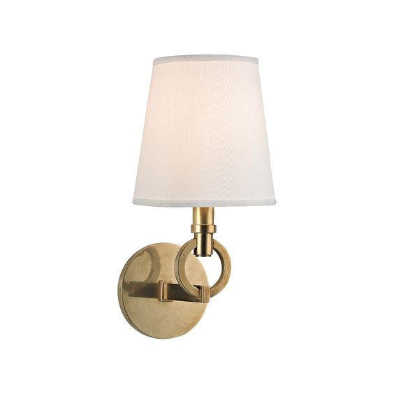 Aged brass finish instills a traditional feel in your home. This Malibu wall sconce is sure to bring the elegance and glamour that you need to create the perfect home. What\'s more, its white faux silk shade further delivers the message that beauty can be simple.