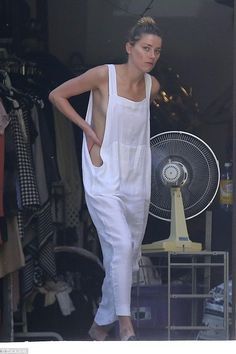 Amber Heard shows a little too much in loose-fitting dress