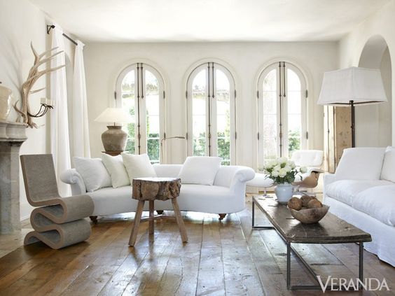 Pamela Pierce's white living room with its luxurious minimalism and mix of French antiques with modern.