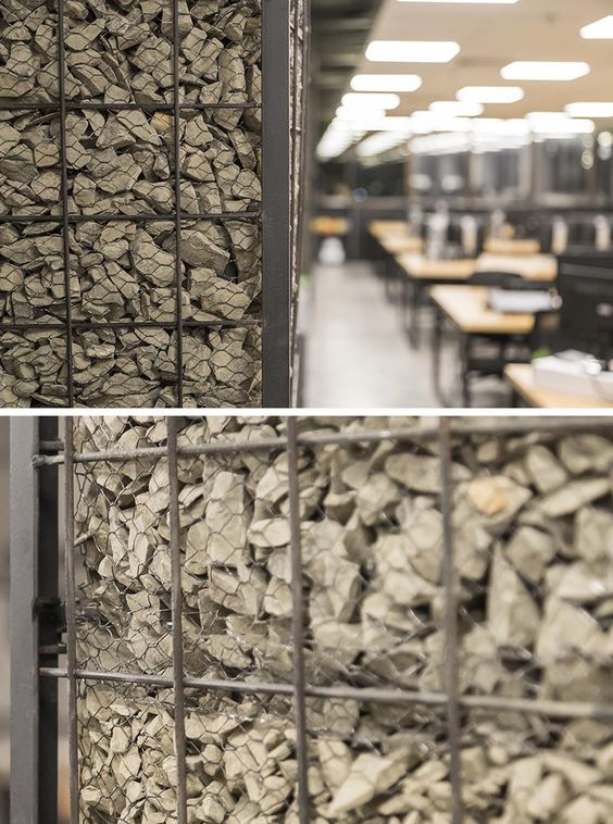 Gabions Hide The Plain Concrete Columns In This Office
