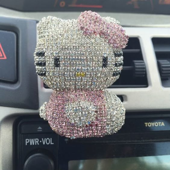 hello kitty car air refresher. All handmade with rhinestone. Very cute and shiny. This one does not include the refresher stick, you can insert your own. All resonable offer considered. I have a pair, let me know if you are interested them. Hello Kitty Accessories