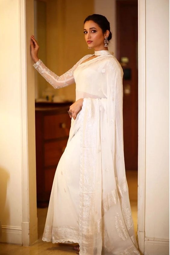 Srinidhi Shetty looks graceful in an ivory silk saree at "Cobra" audio launch!