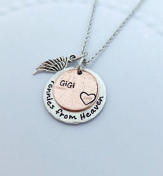 "This beautiful pennies from heaven necklace makes a great gift for your loss of a loved one. Such a great necklace to memorialize that special person in your life who you are missing. It features your personalized name on a penny with the heart around the year. This can also be a wonderful sympathy gift to give a friend or relative. Please leave all names in notes to seller as follows: Penny year: (add year) Penny name: (add name) Comes on an 18\\" stainless steel ball chain with angel wing char