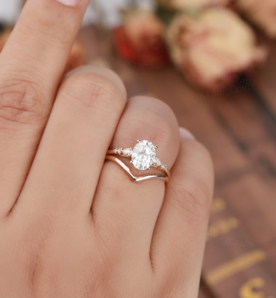 "MADE TO ORDER * Material: Solid gold(14K/18K white/yellow/rose gold) * DETAILS Engagement ring - Center stone:Moissanite/C&C Moissanite(DEF) 6*8mm oval cut - width: approximately 1.7mm - thickness: approximately 1.3mm Side stones:Moissanite or Diamond - diamond:0.16ct,2*3mm pear cut,Color G-H,Clarity SI-VS - moissanite:0.16ct Wedding band Solid Gold Plain Wedding band * Click on the \\"Pin It\\" icon if you like this item * Custom Order We can make custom rings in almost any shape and style. If