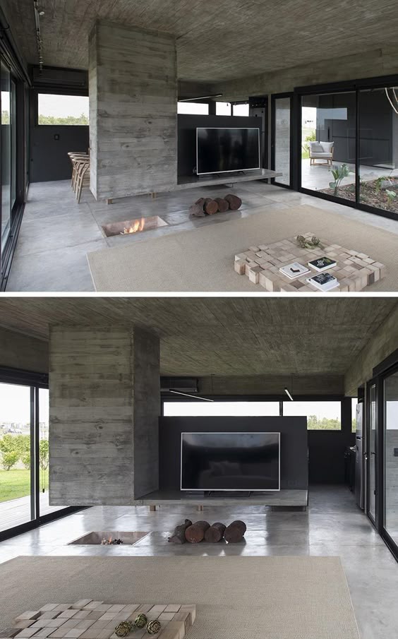 A Concrete Divider Hangs Above An In-Floor Fireplace Inside This Home