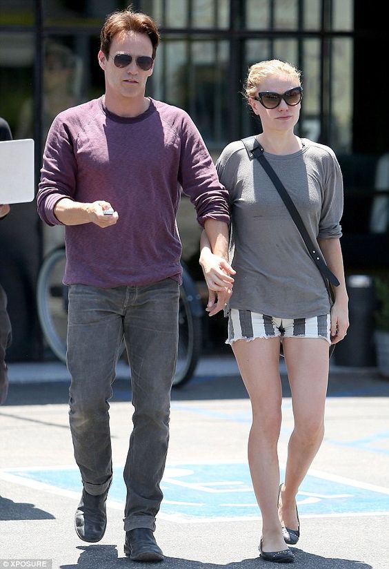 Staying close: Anna Paquin linked arms with her husband and True Blood co-star Stephen Moyer on Friday as the pair strolled through Venice together