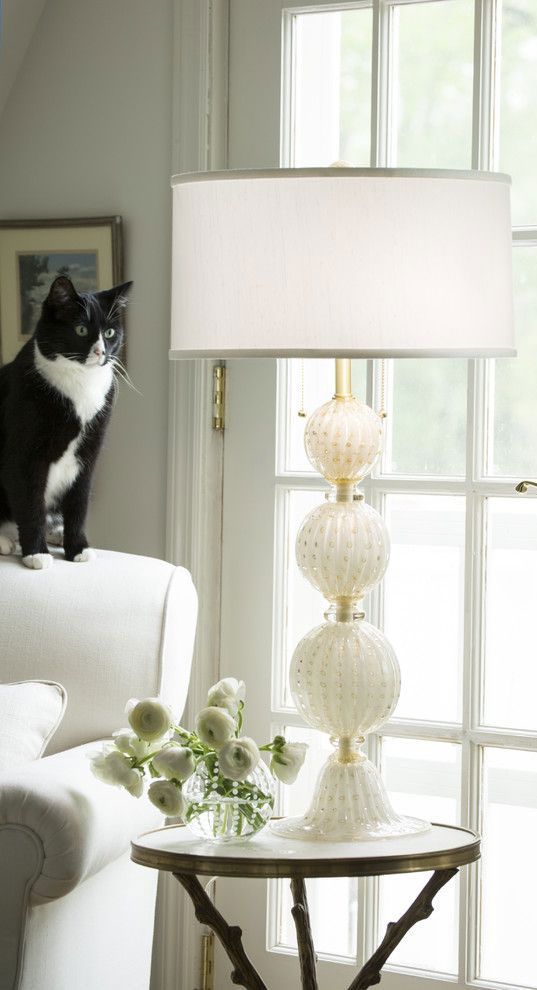 white Murano glass lamp in the living room with cute black and white cat; Venetian glass lamp; Murano glass lamps