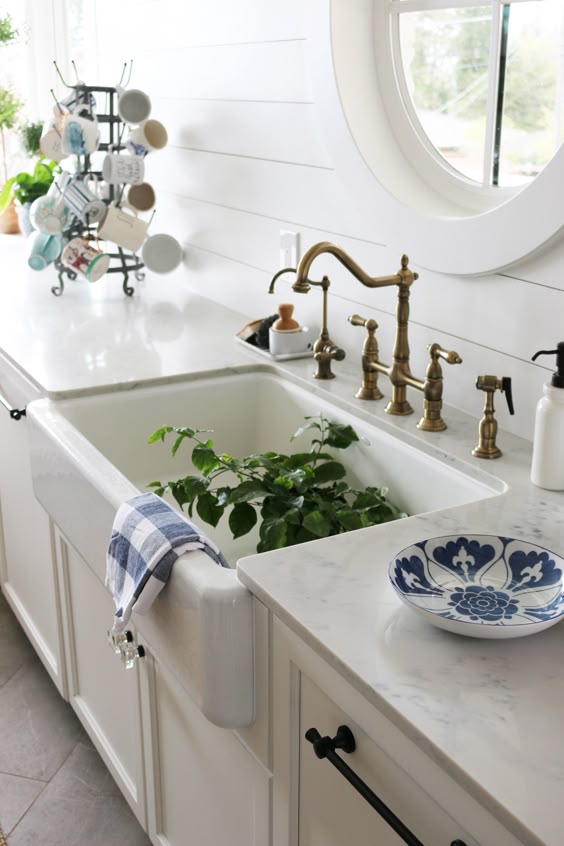 White Quartz Counters with Farmhouse Sink: Carrara Gioia Quartz at Daltile