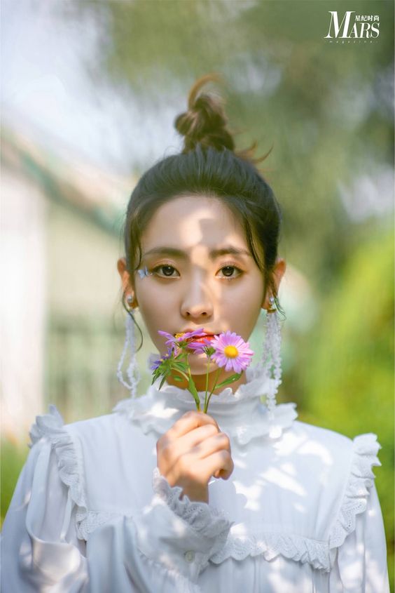 Xing Fei poses for photo shoot