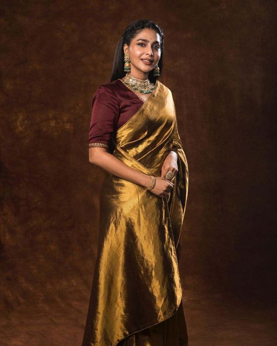 Aishwarya Lekshmi shimmers in a gold silk saree at "PS-1" teaser launch!