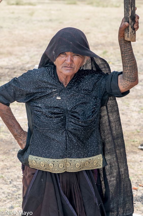 Tattooed Kutchi Rabari Woman Bhachau, Gujarat, India (2013) A tattooed Kutchi Rabari woman at her overnight camp in the Bhachau areaTattooed Kutchi Rabari Woman Bhachau, Gujarat, India (2013) A tattooed Kutchi Rabari woman at her overnight camp in the Bhachau area